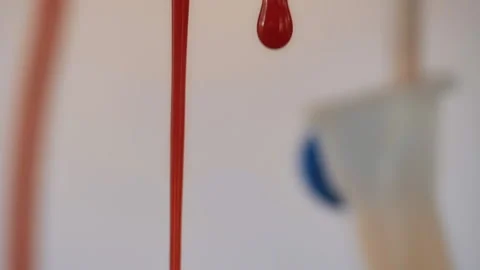 Drops of blood fall down. Allegory of flowing blood. Stock Footage 130486046