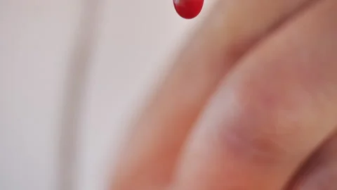 Drops of blood fall down. Allegory of flowing blood. Stock Footage 130487287