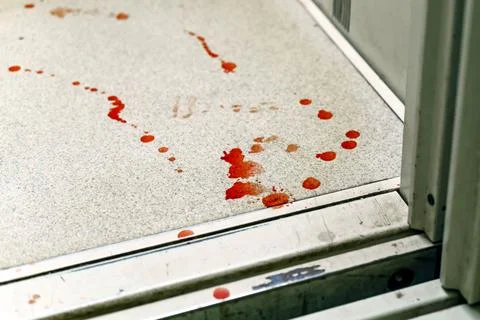 Drops of blood on the floor in the elevator Stock Photos