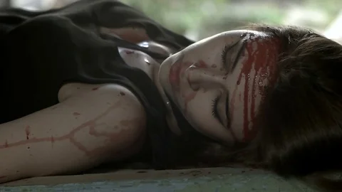 Drops of blood flow down the head of a girl Stock Footage 78205673