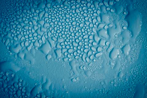 Drops on blue Stock Photos