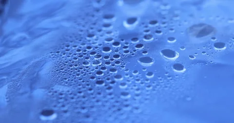 Drops on Blue Sheet Stock Footage 320417445