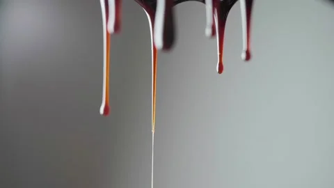 Drops of chocolate are dripping. Video stock 168410306