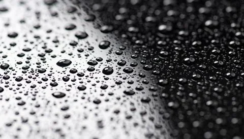 Drops closeup glass texture surface. Drops shape bubble pattern background... Stock Photos