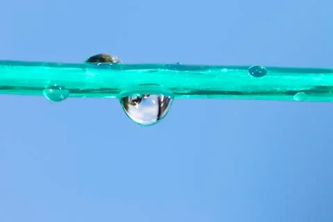 Drops on a clothesline Stock Photos