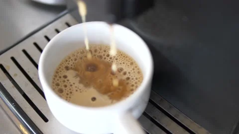 Drops of coffee dripping into a cup Stock Footage 168481359
