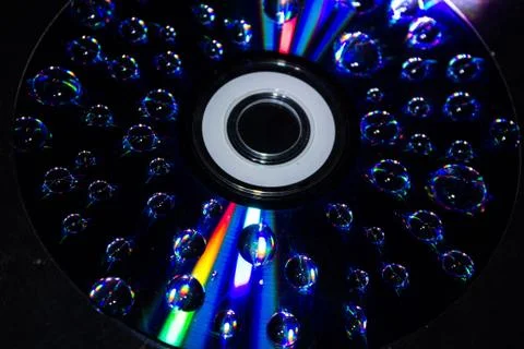 Drops on the computer disk Stock Photos
