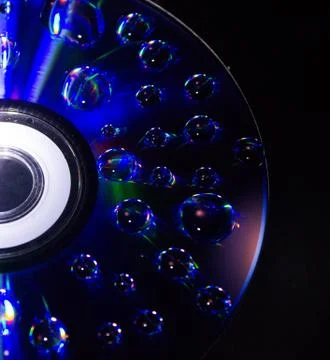 Drops on the computer disk Stock Photos