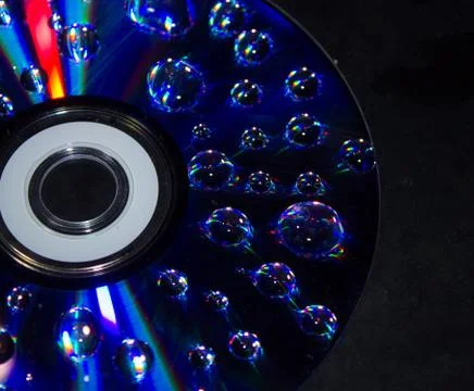 Drops on the computer disk Stock Photos