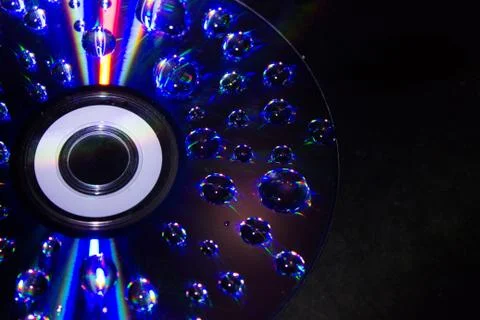 Drops on the computer disk 스톡 사진