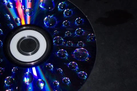 Drops on the computer disk Stock Photos