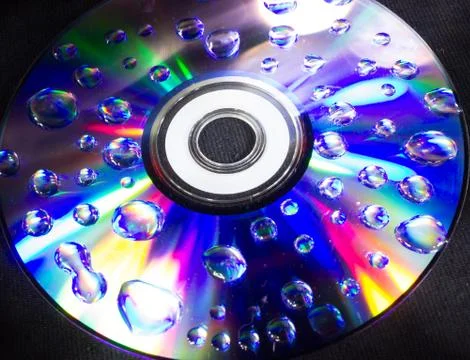 Drops on the computer disk Stock Photos