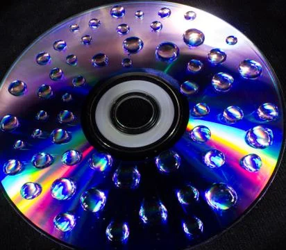 Drops on the computer disk Stock Photos