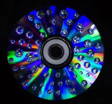 Drops on the computer disk 스톡 사진