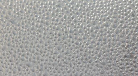 Drops of condensate on the surface of a plastic bottle, close-up Fotos Stock