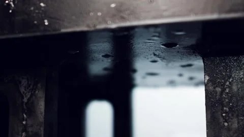 Drops of coolant fall on the metal elements. Stock Footage 98554900
