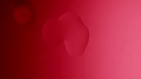 Drops drip from above and scatter across a red gradient background 스톡 동영상 303061145