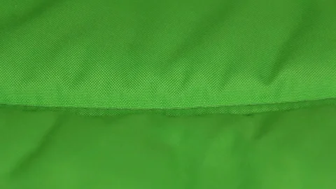 Drops driping to the green tissue Stock Footage 69910589