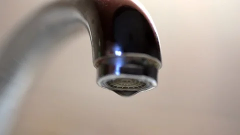 Drops drips from kitchen water tap, macro shot Stock Footage 89361428