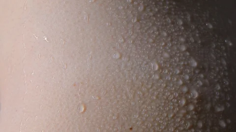 Drops, droplets run down the skin, trickles on wet skin Stock Footage 121271656