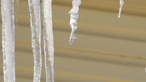 Drops fall from large icicles. Sunny spring day 스톡 동영상 150887240