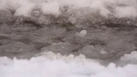 Drops fall on melting snow Stock Footage 84787843