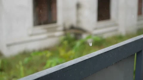 Drops fall on the railing during heavy rain. Melancholy concept Stock Footage 139455126