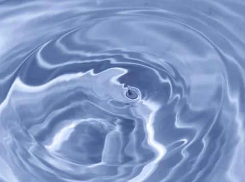 Drops fall into the water. beautiful background Stock Photos