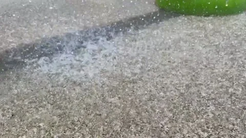 Drops falling on the asphalt  Stock Footage 154336602
