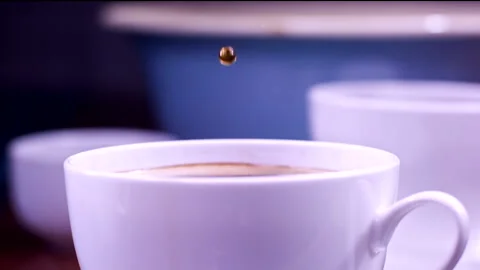 Drops Falling In A Cup Of Coffee In Super Slow-motion 1000fps Stock Footage 130957588