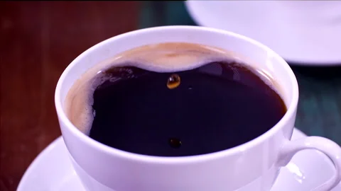 Drops Falling In A Cup Of Coffee In Super Slow-motion 1000fps Stock Footage 130959021