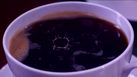 Drops Falling In A Cup Of Coffee In Super Slow-motion 1000fps Stock Footage 130965417