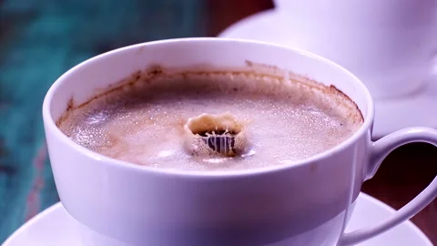 Drops Falling In A Cup Of Coffee In Super Slow-motion 1000fps Stock Footage 130965665