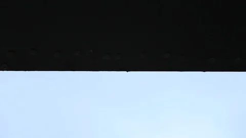 Drops Falling down from a steel girder Stock Footage 95757050