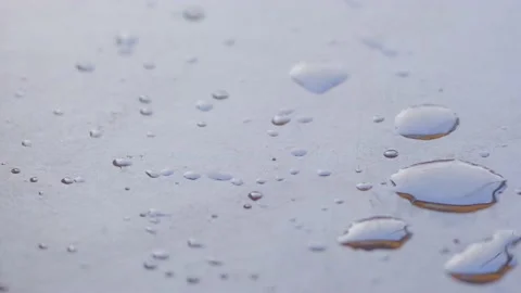 Drops falling on gray surface 動画素材 232222438