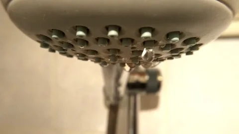 The drops falling from the watering can shower in the bathroom close up Stock-Footage 73873482