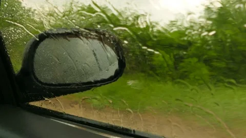 Drops flow down the glass car during rain Stock-Footage 95453977