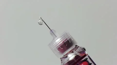 Drops follow from a needle Stock Footage 12264521
