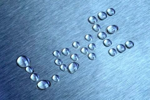 Drops in the form of words like. The surface is metallic blue Stock Photos