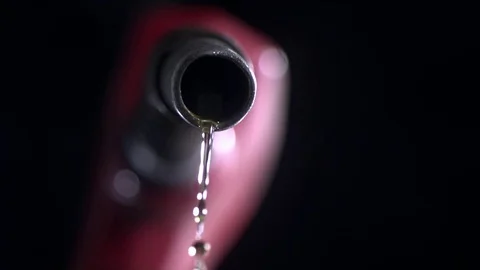 Drops of fuel dripping from the nozzle in slow motion Vídeos de archivo 81225997