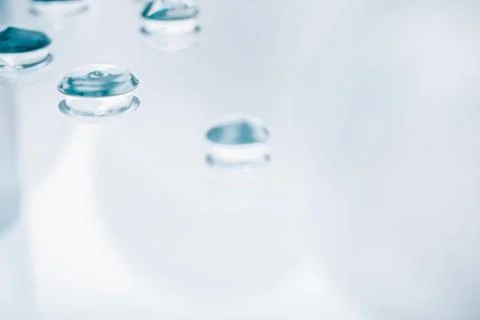 Drops of gel on a mirror surface. Fotos Stock