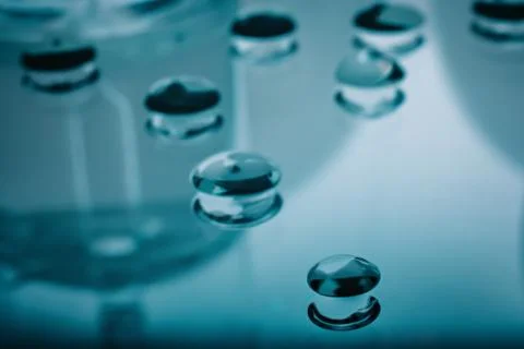 Drops of gel on a mirror surface. Stock Photos