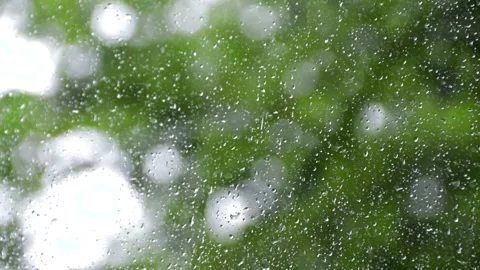 Drops on the glass . Drops trickle down the glass. The rain outside the window Stock Footage 142287894