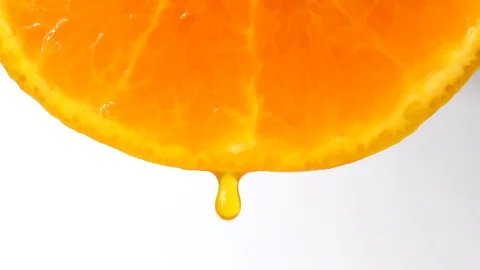 Drops of juice of a citrus on white background Stock Footage 97372995