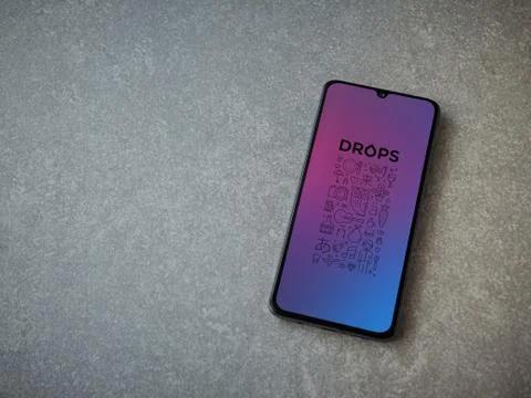 Drops - Language learning app launch screen with logo on the display of a bla Foto stock