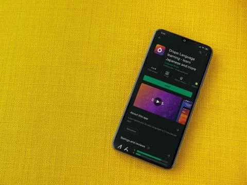 Drops - Language learning app play store page on the display of a black mobil Foto stock
