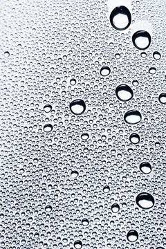 Drops macro on minimal background background design. Drops form seamless fluid Stock Photos