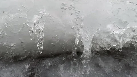 Drops of melting snow flow down Stock Footage 230914857