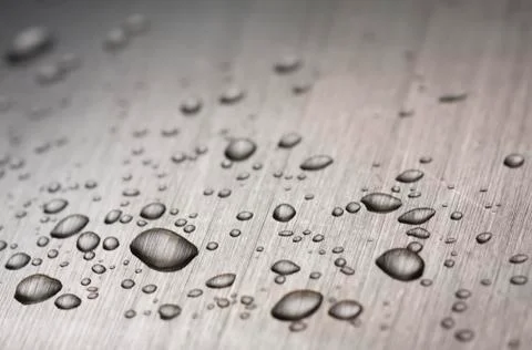 Drops on metal Stock Photos