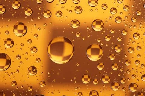 Drops over a chess board Stock Photos